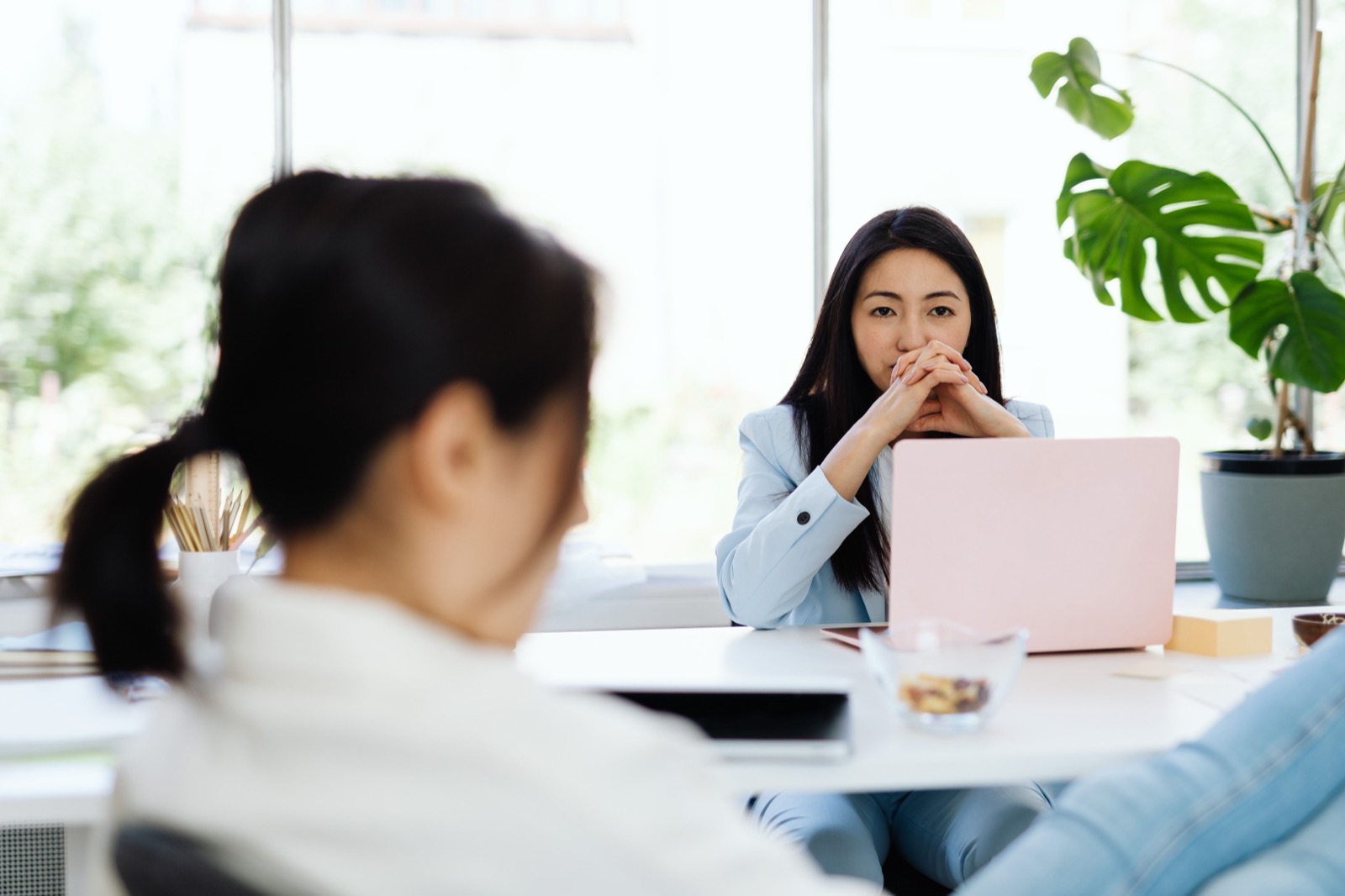 A leader listening across the table during a focused working session