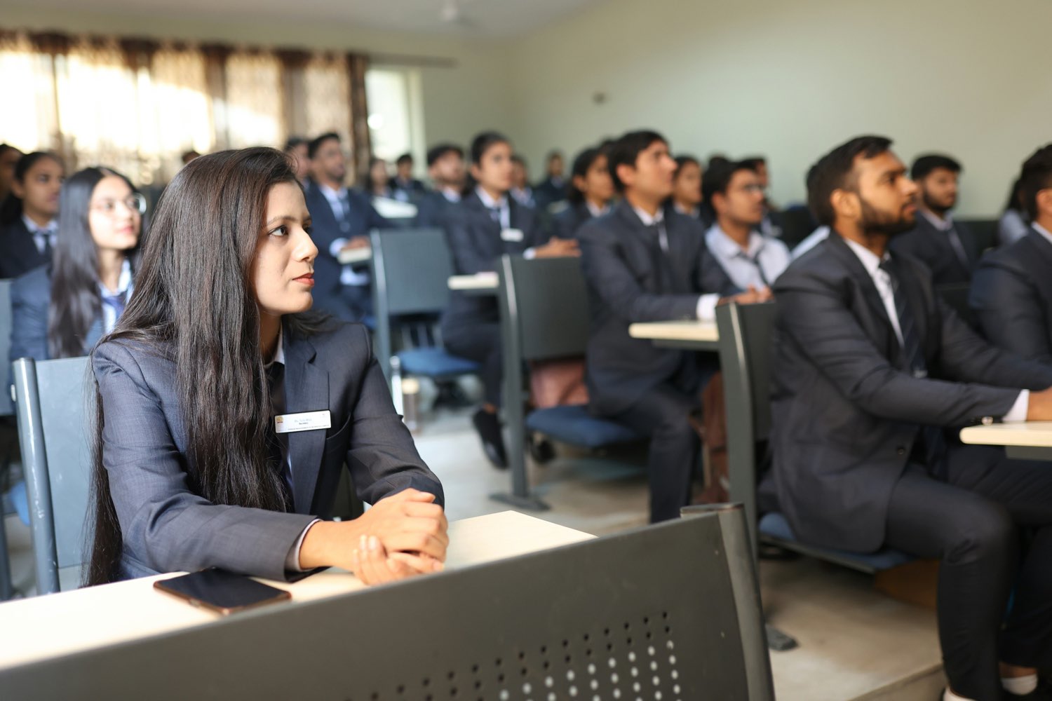 Participants seated through a session in a full lecture hall